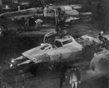 Poncho Luke and Han talking in the rebel hangar. Note the Y-wing is short one wing. From the Star Wars Sourcebook.