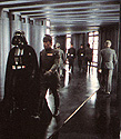 Vader and Bast walk down one of the endless Death Star corridors.  From The Star Wars Album.