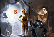 Threepio lectures Artoo about the Wampas trapped behind the door.  From Star Wars Insider #49.