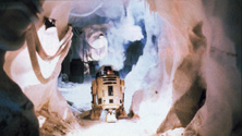 Artoo heads down a corridor just before a Wampa breaks through behind. From Star Wars Insider #49.