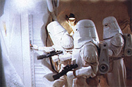 One of the troops pushes the button to open the door.  From Star Wars Insider #49.