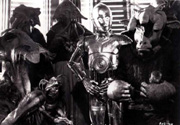 Threepio stands between Saelt-Marae and Ree-Yees, translating.  Image source unknown.