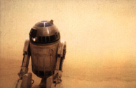 Artoo leads the party through the storm following a homing beacon, according to the novel.  From the Star Wars Insider #35.