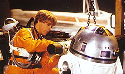 Luke and Artoo work on the engine